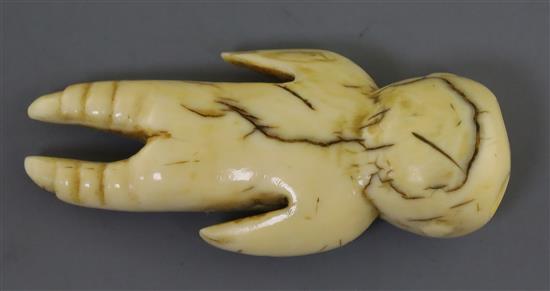 A Tongan or Fijian whale tooth pendant, PLEASE NOTE WE ARE UNABLE TO DATE THIS PIECE H. 5.5cm
